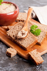 Chicken liver pate on bread, close up, vertical