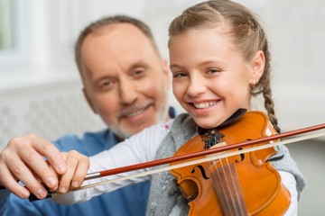 Nice girl playing the violin 