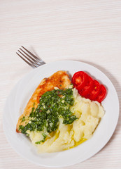 Roasted chicken breast with pesto sauce and mashed potatoes