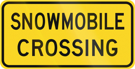 Warning road sign in Canada - Snowmobile crossing. This sign is used in Ontario