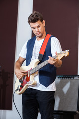 Male Performer Playing Electric Guitar