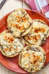 Sandwiches with mushrooms and cheese.