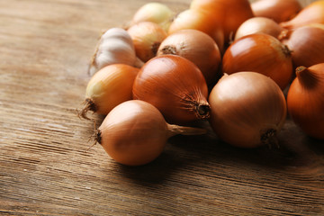 Onion on wooden background