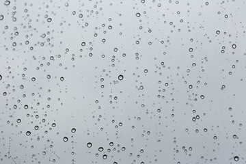 Cold rain drops on window