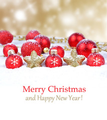 Colorful christmas decoration baubles on white with space for text