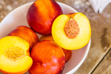 peaches and whipped cream on a retro wooden background