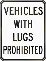 Regulatory sign in Canada - Vehicles with lugs prohibited. This sign is used in Ontario