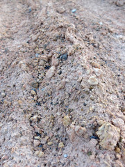 Wheel track in laterite soil excavation site, construction textu