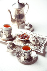 Antique tea-set on table close-up