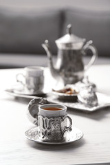 Antique tea-set on table close-up