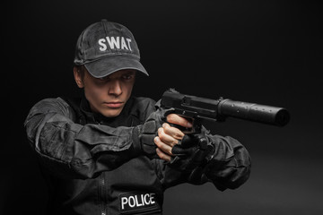 SWAT police officer with pistol 