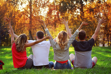 group of young people in the autumn picnic