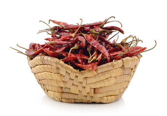 Obraz premium dried chili in the basket on white background