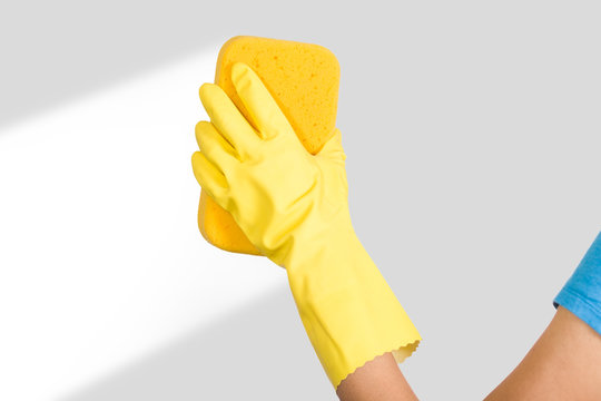 Woman Hand In Yellow Glove With Sponge On White Background