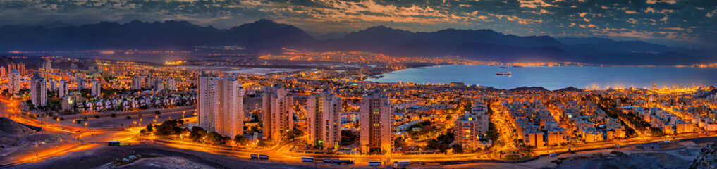Nocturnal panaramic view on Eilat (Israel) and Aqaba (Jordan) cities at the northern part of the...