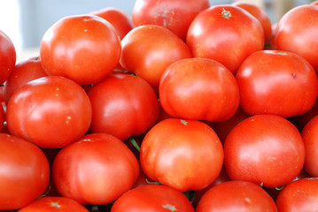 fresh tomatoes for sale on a market