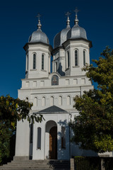 Front view of a romanian church on a blue sky