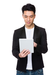 Asian Young Businessman use of the tablet pc