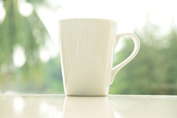 Coffee Cup with a Nature Scenery in the Morning