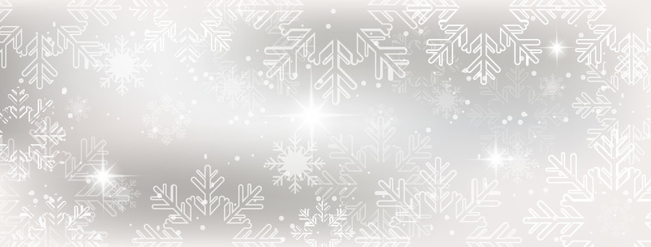Winter wallpaper with snow, snowflakes and glowing stars.