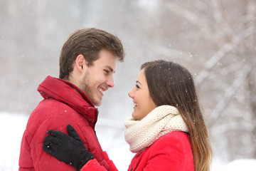 Fototapeta premium Couple looking each other in winter