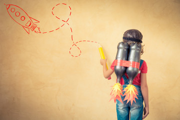 Kid playing with jet pack at home