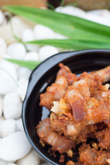 Fried pork on black plate