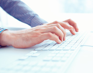 Male hands or men office worker typing on the keyboard