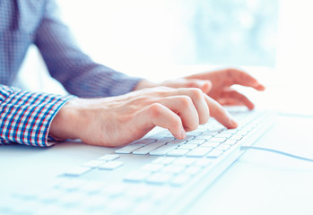 Male hands or men office worker typing on the keyboard