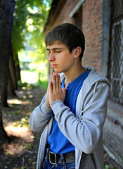 Young Man praying outdoor