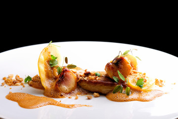 Haute cuisine, roasted Foie gras with homemade ravioli and apples © Visionsi