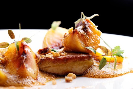 Haute cuisine, roasted Foie gras with homemade ravioli and apples