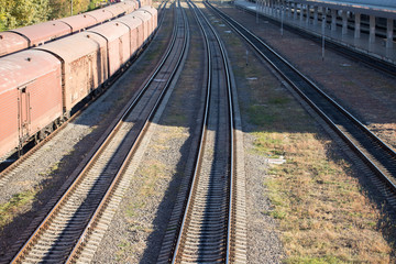 Obraz premium Railway tracks near train station