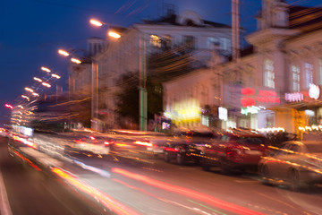 Fototapeta na wymiar Blurred background night street with cars