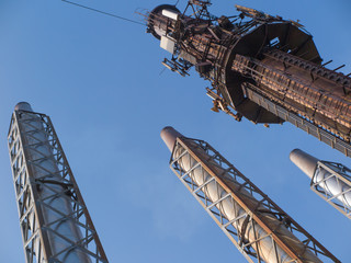 four steel chimneys on a background of blue sky