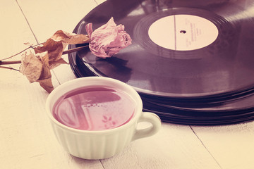 Old vinyl records, dried rose and a cup of tea