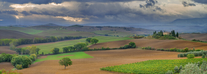 clouds above tuscany landscape in Italy
