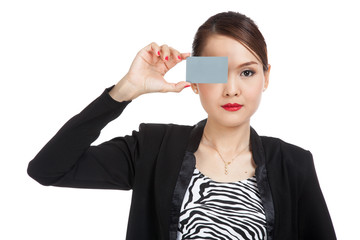Young Asian business woman with a blank card over her eye