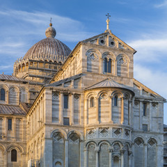 front of cathedral in sunset light in Pisa in Italy