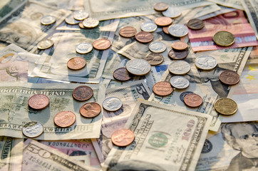 US Dollar and Euro with coins as background