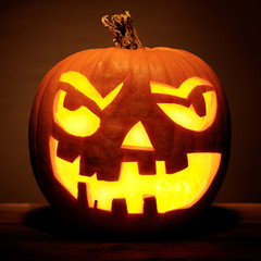 Halloween pumpkin head jack lantern with scary evil faces spooky