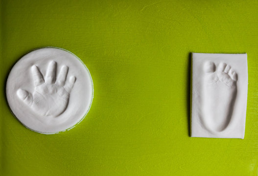 Baby handprint and footprint with copy space. New life concept