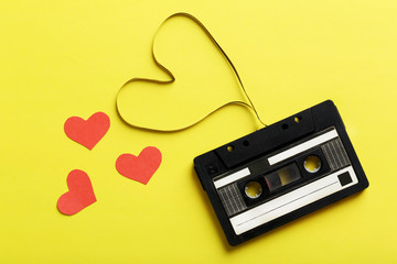 Audio tape cassette on yellow paper background