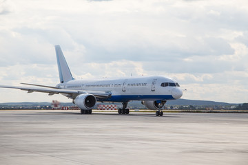 modern aircraft was taxiing on the runway closeup