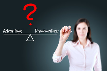 Young business woman writing advantage and disadvantage compare on balance bar. Blue background.