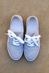 Pair of grey shoes outdoors