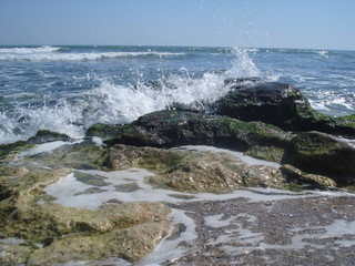 Sea waves crashing against rocks at the seashore