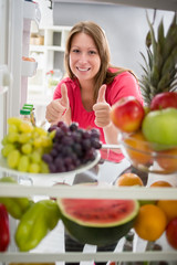 Woman show thumb up for healthy food