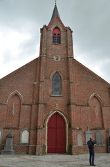 Obraz premium Brick church with red door