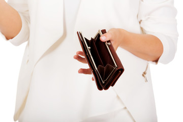 Young businesswoman holds empty wallet